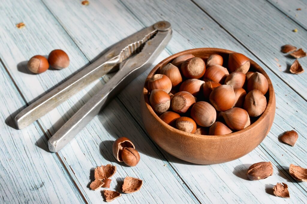 Hazelnuts in bowl with nutcracker