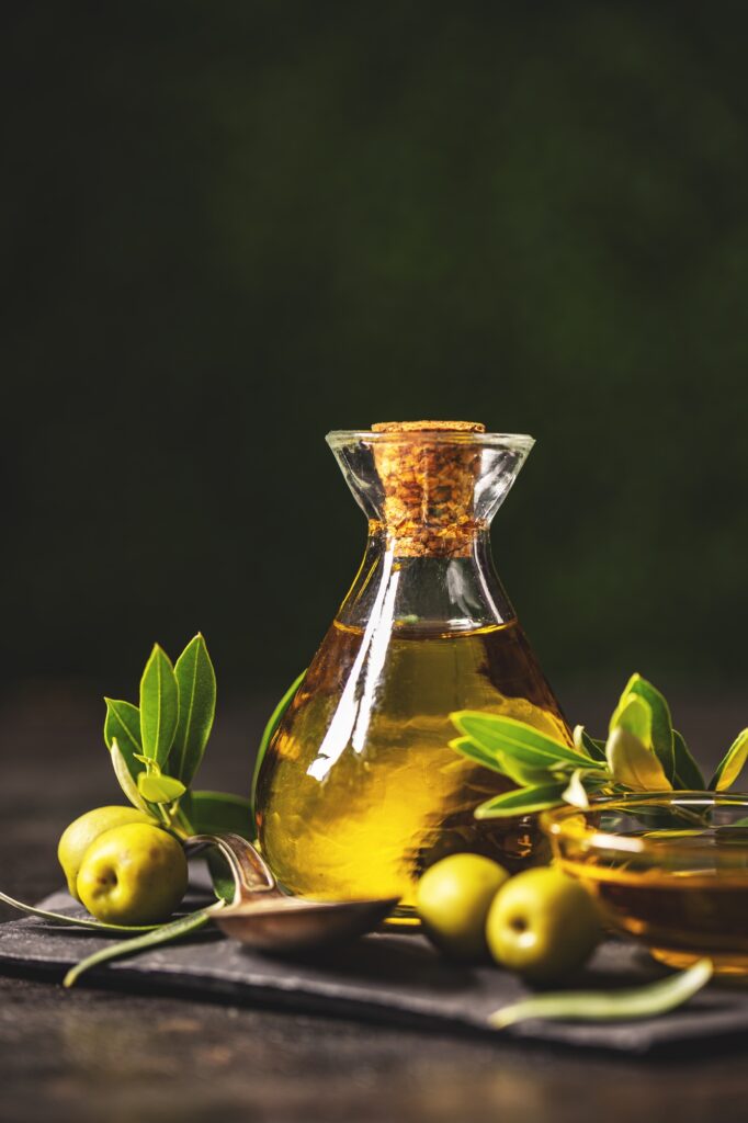 Olive oil bottle with olives